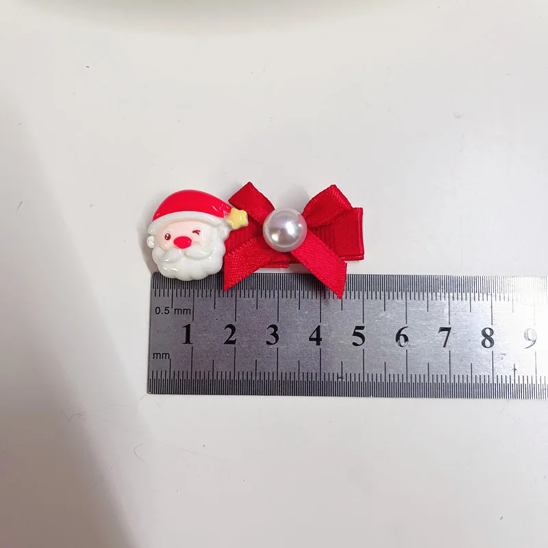 Size reference for the shared Santa clip in these two sets, shown against a centimetre ruler. The other clip varies by set; see the first photo for your selected pair.